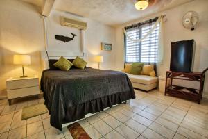 Letto o letti in una camera di Coconut Palms Inn