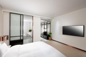 Voodi või voodid majutusasutuse N Bridge Hotel JEON JU toas