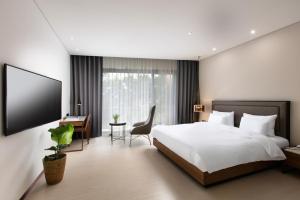 Voodi või voodid majutusasutuse N Bridge Hotel JEON JU toas