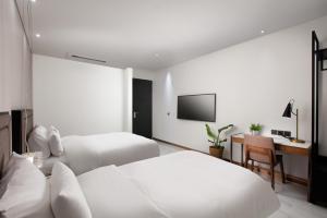Voodi või voodid majutusasutuse N Bridge Hotel JEON JU toas