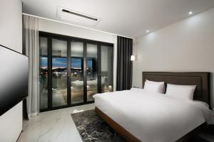 Voodi või voodid majutusasutuse N Bridge Hotel JEON JU toas