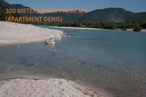 a river with the words meters away from my apartment deaths at Apartments Denis in Tolmin