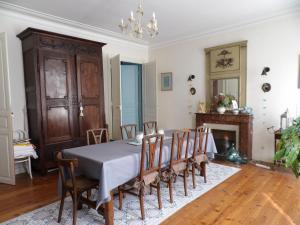 a dining room with a table and chairs at Le Clos Sainte Foy in Morlaas