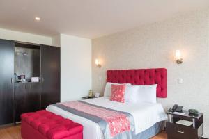 Ένα ή περισσότερα κρεβάτια σε δωμάτιο στο Hotel Varuna