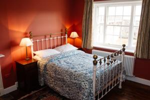 a bedroom with a bed and a window at Elizabeth Fort in Cork