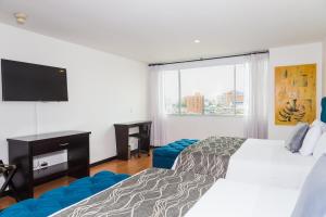 Ένα ή περισσότερα κρεβάτια σε δωμάτιο στο Hotel Varuna