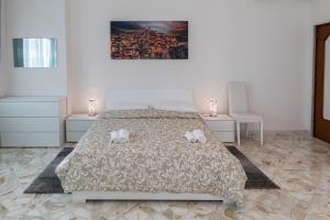Postel nebo postele na pokoji v ubytování XX Settembre Matera - Apartment