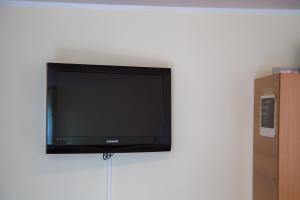 Televízia a/alebo spoločenská miestnosť v ubytovaní Zagarella House