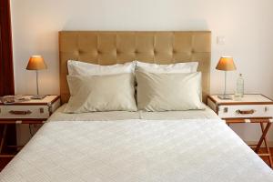 
A bed or beds in a room at Eugaria Country House by Lost Lisbon
