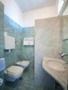 Koupelna v ubytování Hotel Norma