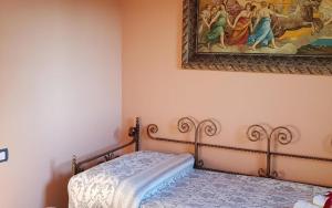 A bed or beds in a room at Podere agli Arrighi Még 37 kép
