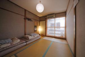 A bed or beds in a room at Oyado Shogoin