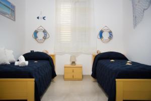 Ένα ή περισσότερα κρεβάτια σε δωμάτιο στο Casa Mare e Fiori nella Valle Dei Templi