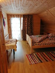 Postel nebo postele na pokoji v ubytování Cabana Ghetari