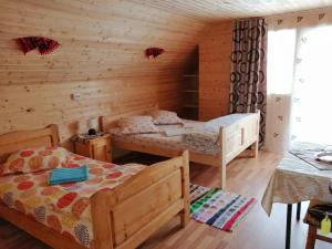 Postel nebo postele na pokoji v ubytování Cabana Ghetari