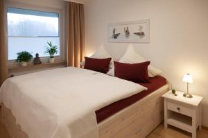Ένα ή περισσότερα κρεβάτια σε δωμάτιο στο Ferienwohnungen Tobian