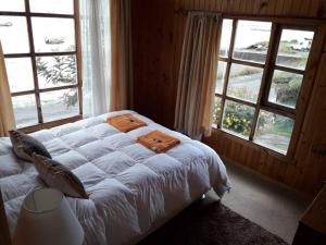 Кровать или кровати в номере Hostal Guarida del Trauco