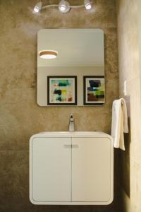 a bathroom with a white sink and a mirror at HOTEL CAREYES in Coatzacoalcos