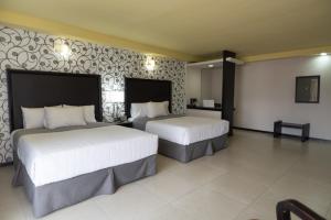 Voodi või voodid majutusasutuse Hotel Ha toas
