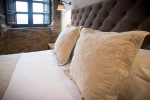 Cama o camas de una habitación en Aldea Rural y Gastro Restaurante Casona de Labrada