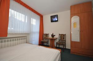 Кровать или кровати в номере Willa Hostel Kasprowy