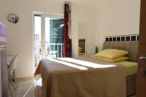 a bedroom with a bed and a large window at Villa Ani in Novalja +60 photos