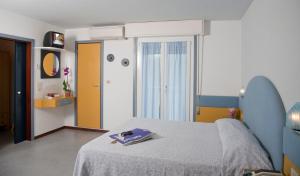 Postel nebo postele na pokoji v ubytování Hotel Norma
