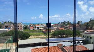 a view of a city from a building at Cantinho da Gê-"Sinta-se a vontade!"-Maragogi in Maragogi