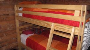 a couple of bunk beds in a room at Arctic Chalet Resort in Inuvik