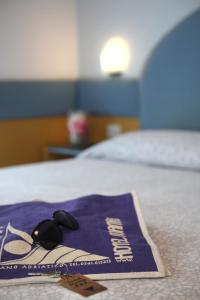 Postel nebo postele na pokoji v ubytování Hotel Norma