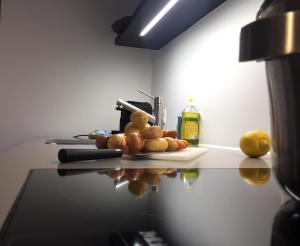 a counter with fruits and vegetables on a table at VIADUKT Apartments in Zürich