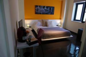 Łóżko lub łóżka w pokoju w obiekcie Hotel Los Nardos