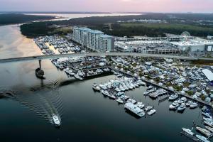 an aerial view of a marina with boats in the water at The Gulf Tower Condos in Gulf Shores