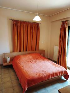 Ein Bett oder Betten in einem Zimmer der Unterkunft Nadia Apartments