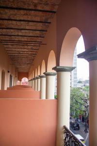 a row of columns in a building with a ceiling at Asuncion Palace in Asuncion