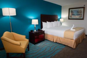 Ein Bett oder Betten in einem Zimmer der Unterkunft Caribe Hotel Ponce