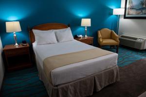 Ein Bett oder Betten in einem Zimmer der Unterkunft Caribe Hotel Ponce