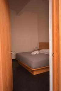 Säng eller sängar i ett rum på HOTEL CASA SANTO TOMAS