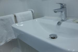 Koupelna v ubytování Hotel Club Cala Romani