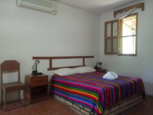 Tempat tidur dalam kamar di El Bosque Hotel