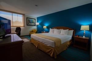Ein Bett oder Betten in einem Zimmer der Unterkunft Caribe Hotel Ponce