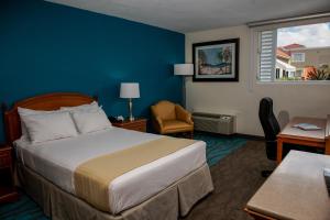 Ein Bett oder Betten in einem Zimmer der Unterkunft Caribe Hotel Ponce