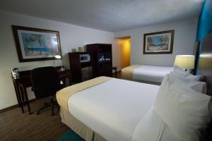 Ein Bett oder Betten in einem Zimmer der Unterkunft Caribe Hotel Ponce