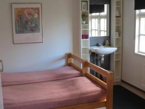 Postel nebo postele na pokoji v ubytování Håverud Hostel