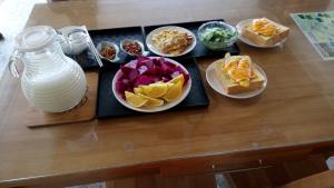 a table with plates of food on a table at Brown No.3 B&B in Chishang