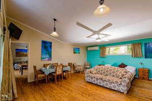 a living room with a couch and a dining room at Bulwarra Bed & Breakfast in Dubbo