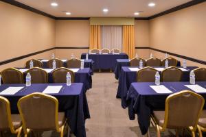 a conference room with blue tables and chairs at Hotel Chino Hills in Chino Hills +20 photos
