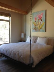 a bedroom with a bed with a swing at Stone Canyon Inn in Tropic