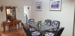 a dining room with a table and chairs at Walsh's Guesthouse in Christ Church