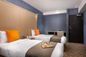 Postel nebo postele na pokoji v ubytování Click Hotel - Taipei Main Station Branch